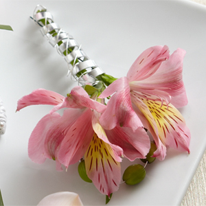 The FTD Pink Peruvian Lily Boutonniere