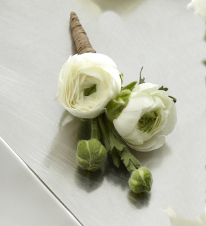 The FTD White Ranunculus Boutonniere