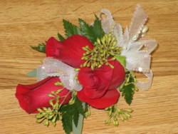 Three red rose corsage