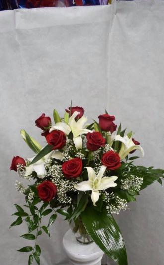 red roses with white lillys