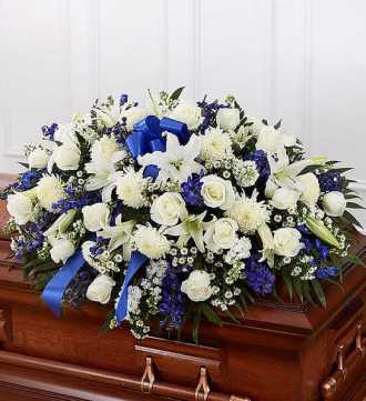 blue and white casket spray