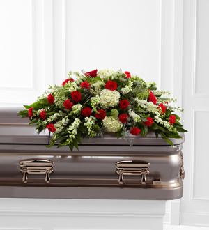 Red and white casket spray flowers for same day delivery to funeral homes in Grand Rapids, Michigan, in Canada and world wide with Sunnyslope Floral