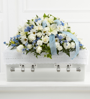 Send white and blue casket spray flowers for same day delivery to Grand Rapids, Walker, Holland, Byron Center and Grandville with Sunnyslope Floral